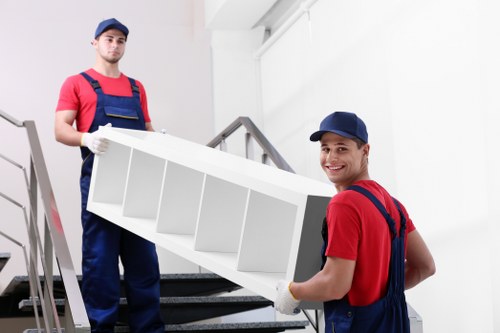 Expert packers organizing household items for a Thorntonheath move