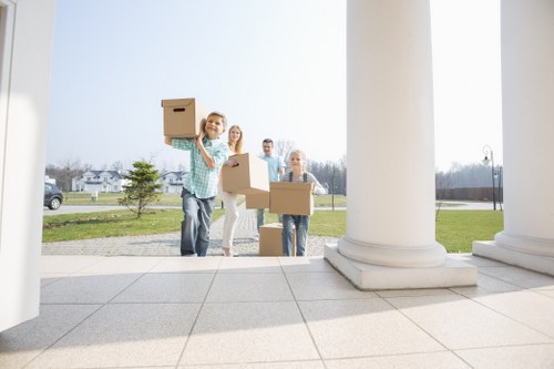 Professional removals in Thorntonheath with packed moving boxes and transport vehicle